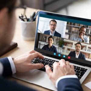 istockphoto-1224889785-612x612 View over businessman shoulder at laptop where four multiracial colleagues engaged at group meeting on-line, video conference call communicating by webcam, distant webinar, online negotiations concept