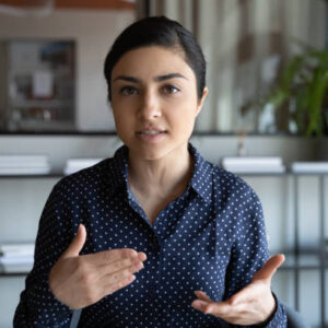 istockphoto-1266809632-612x612 Head shot web camera view focused young indian employee holding negotiations video call with clients, discussing project online. Concentrated millennial mixed race job seeker involved in interview.